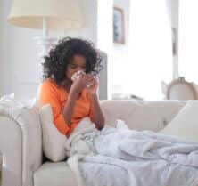 woman sneezing