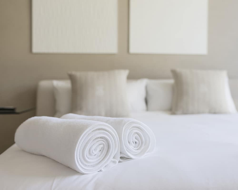 Towels on bed in bedroom
